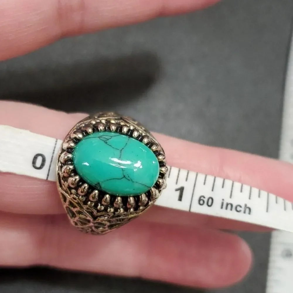 Silver tone ring with blue stone approx 11